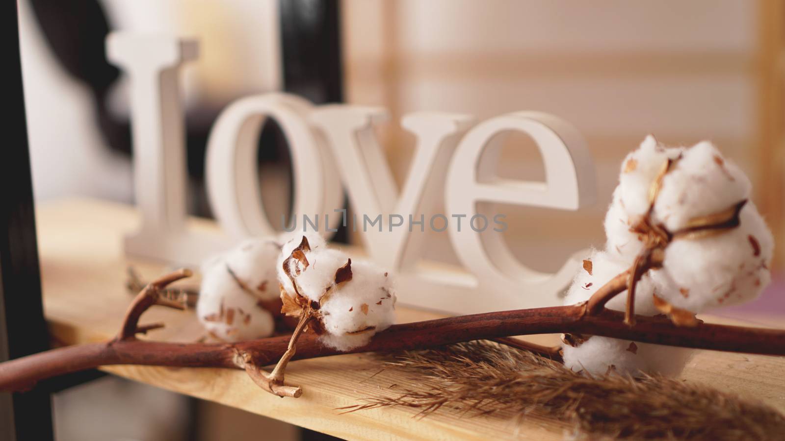 Love wooden letters, vintage styled and cotton flower - blurred background for banner and invitation card
