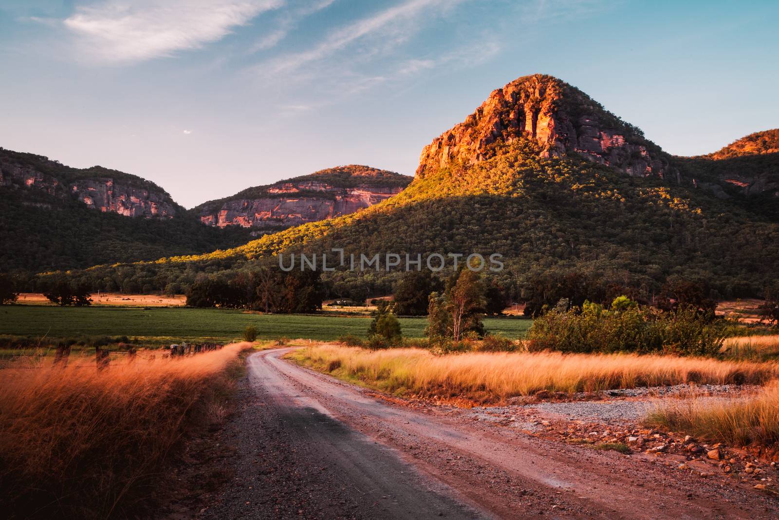 Late afternoon light just before the sun sinks behind the mountain range in the Capertee Valley, regarded as the widest canyon in the world