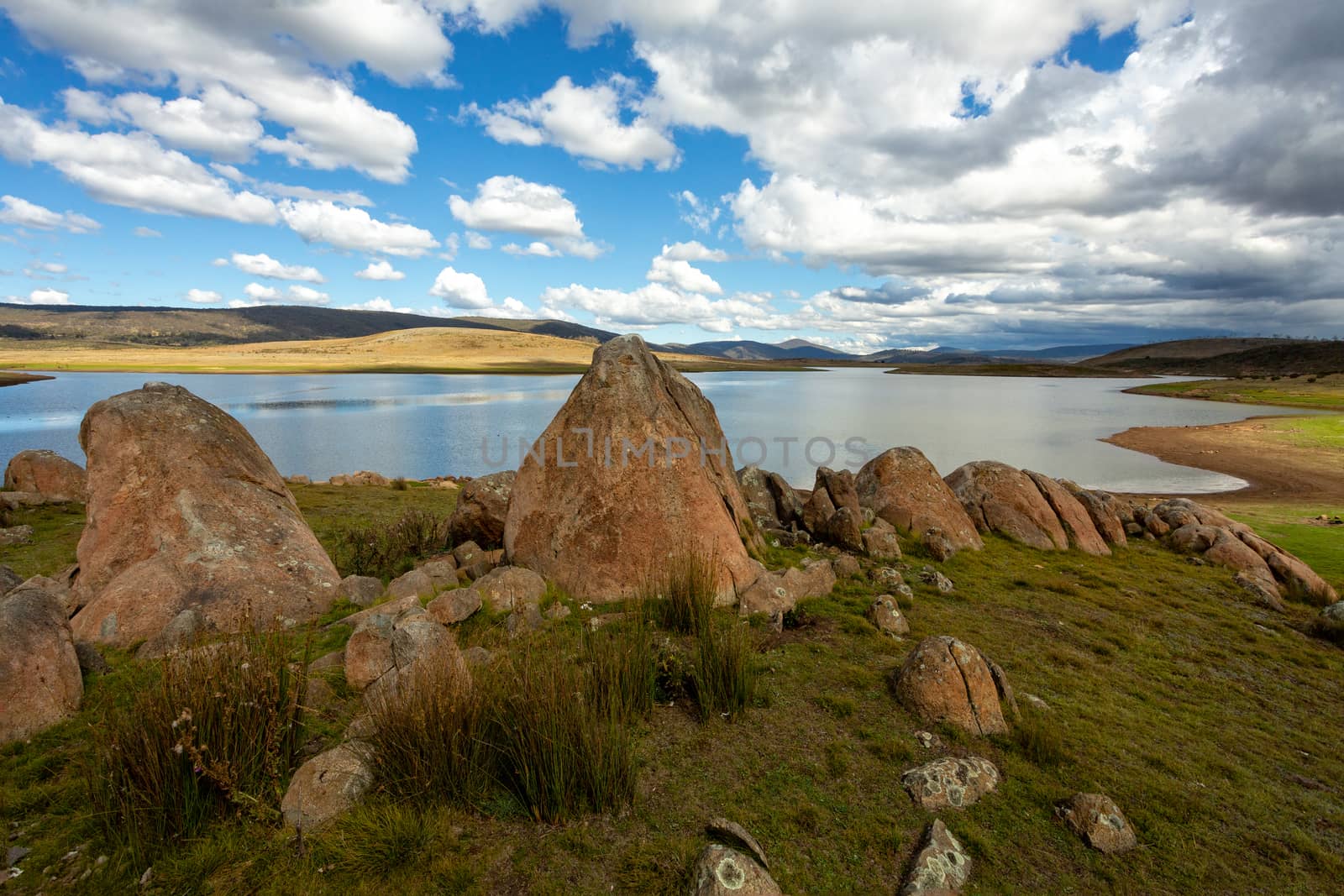 Rocky tors lakes and fields of Snowy High Plains by lovleah