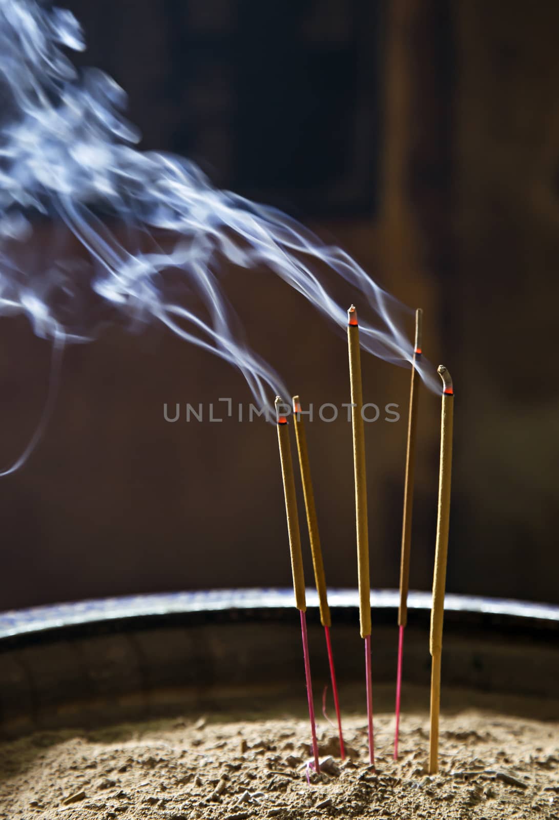 Burning incence sticks in a Buddhist temple