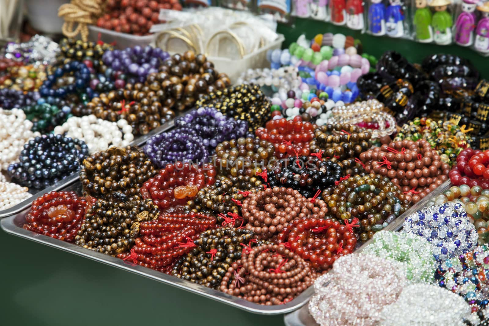 Various colorful beads and bracelets at a Vietnamese market