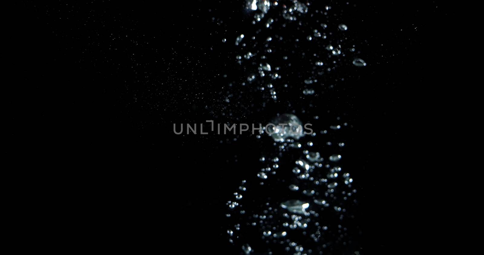 Blurry images of drinking water liquid bubbles or carbonate drink or oil shape or soda splashing and floating drop in black background for represent sparkling refreshment and refreshing