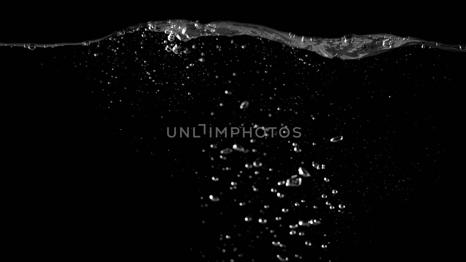 Blurry images of sparkling water liquid bubbles splashing by gnepphoto