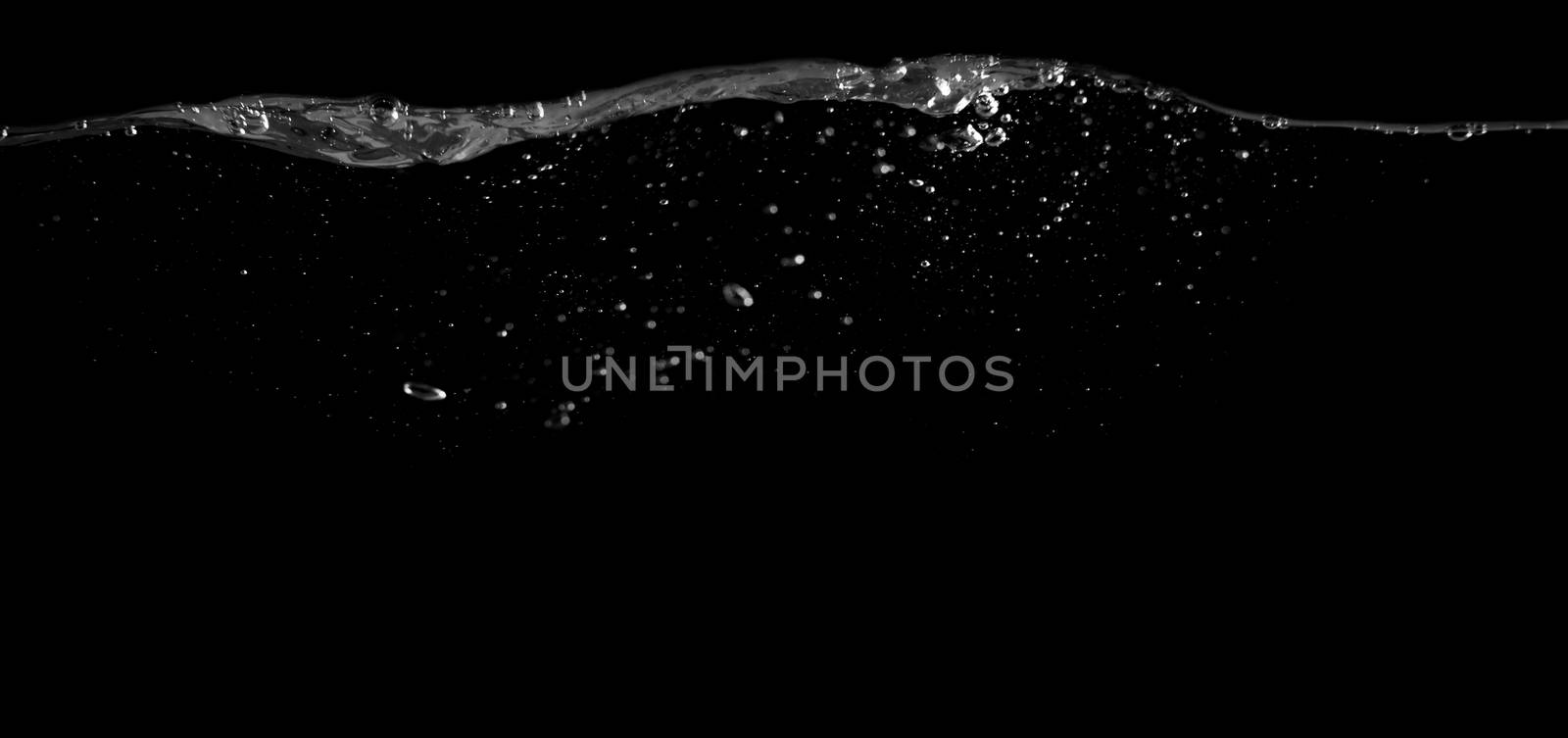 Blurry images of sparkling water liquid bubbles splashing by gnepphoto