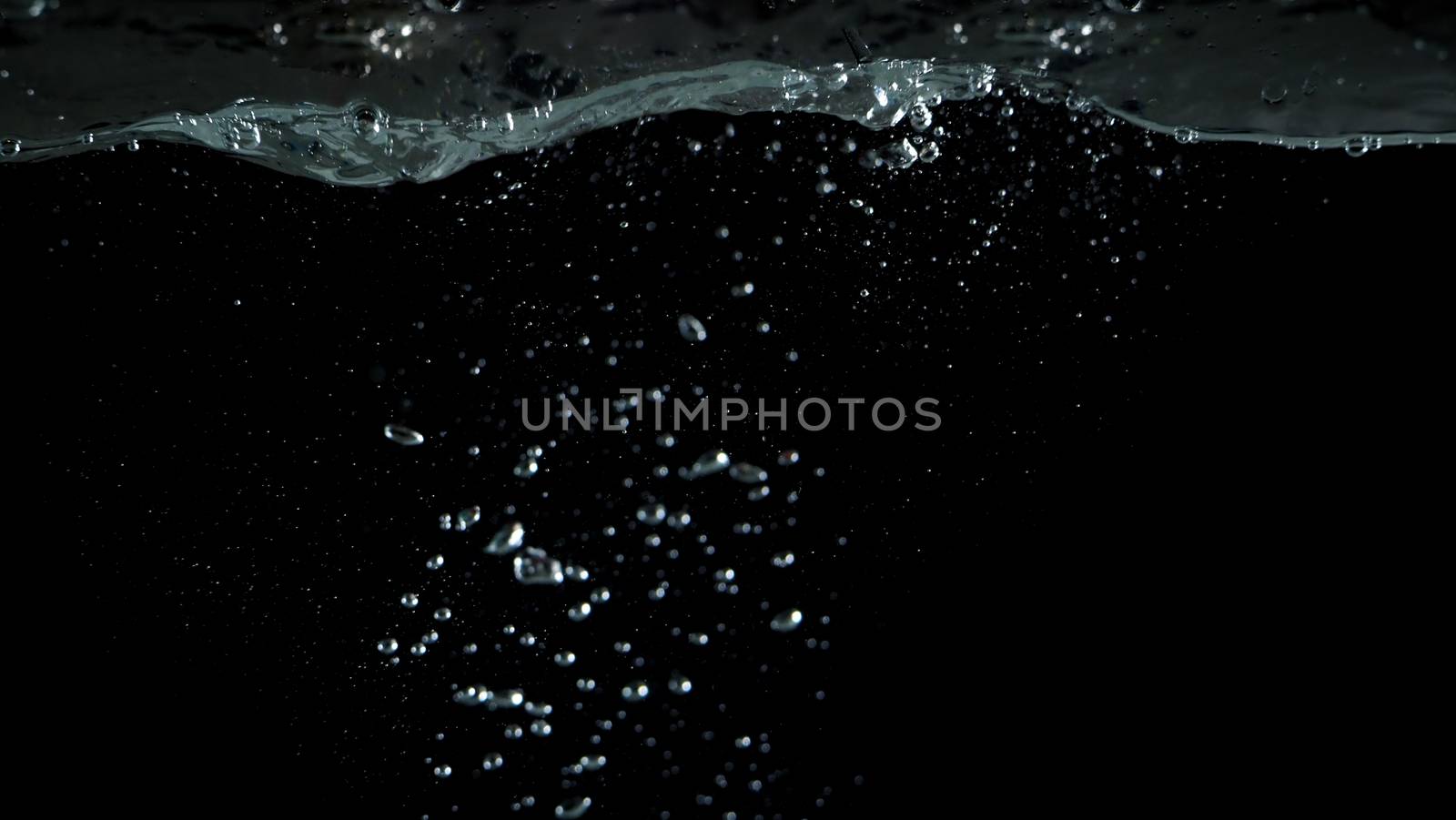 Blurry images of sparkling water liquid bubbles splashing by gnepphoto