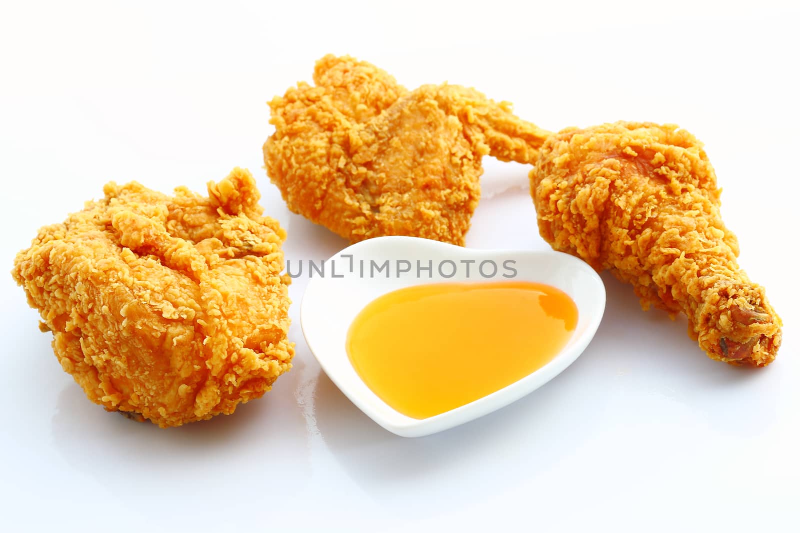 Group of fried chicken with sauce isolated on white background.