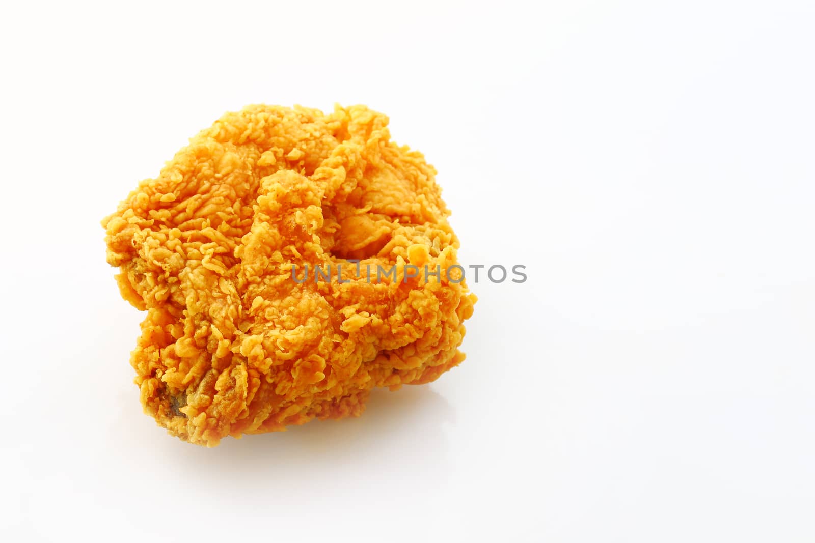 Fried chicken breast isolated on a white background.