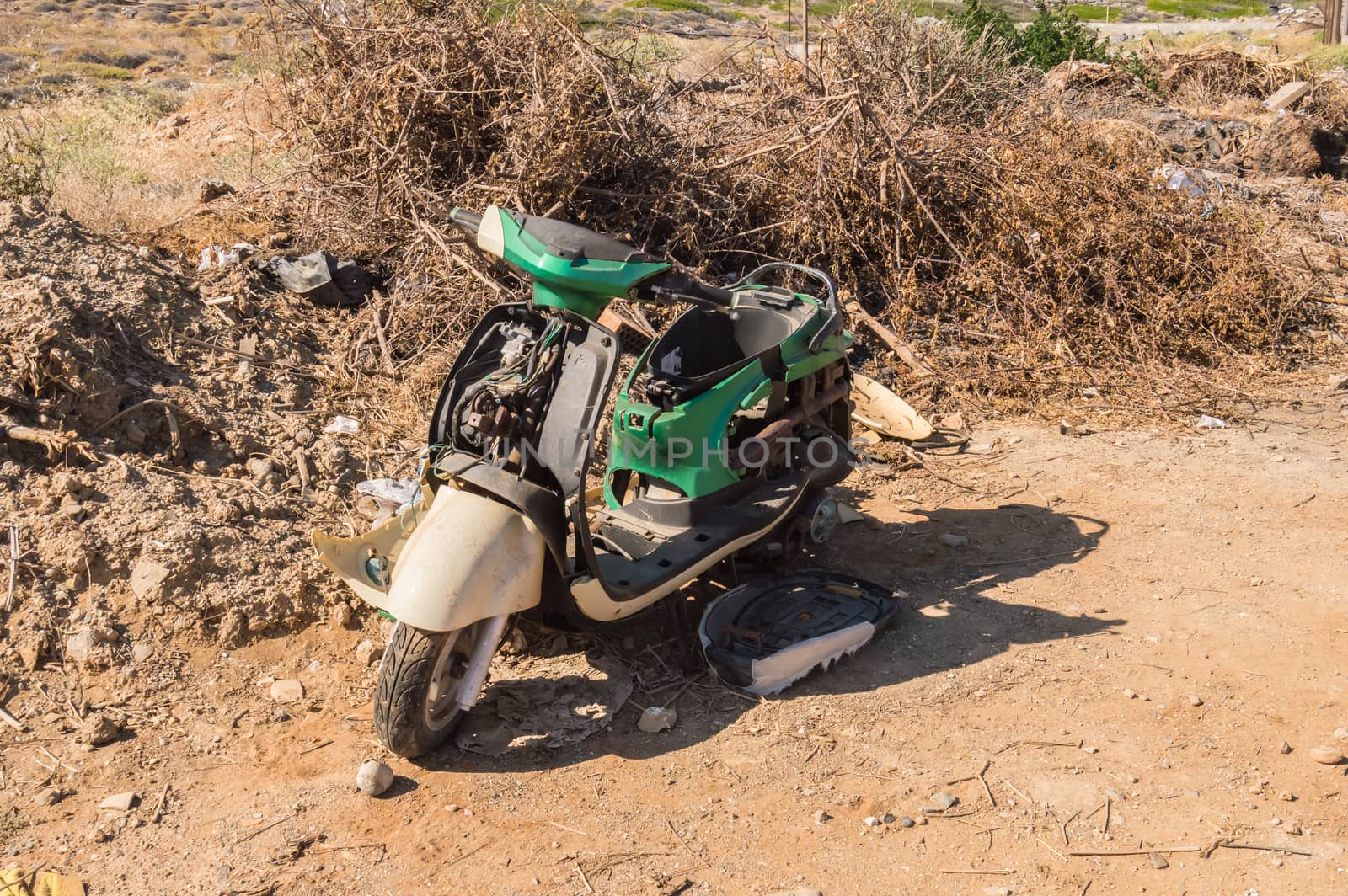 Old motorcycle destroyed. Old abandoned motorcycle in a deserted area of Crete island in Greece