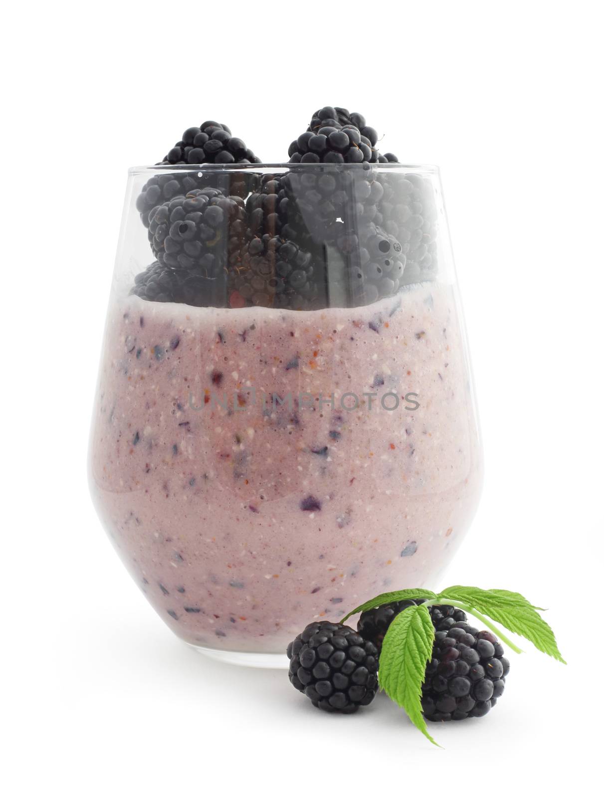 Smoothie and fresh berries blackberry studio isolated on white background