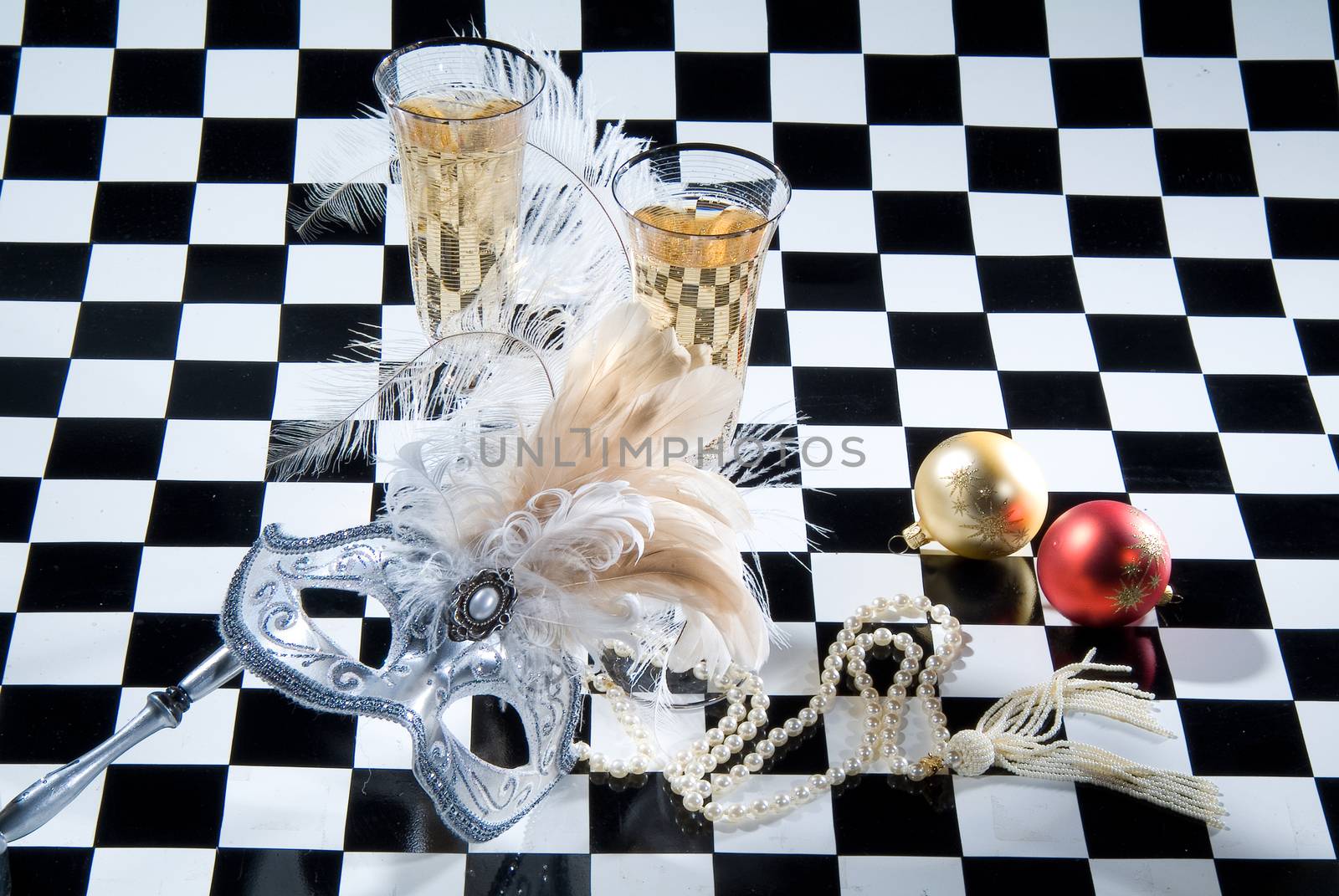 Decorative elements on a checkered studio background