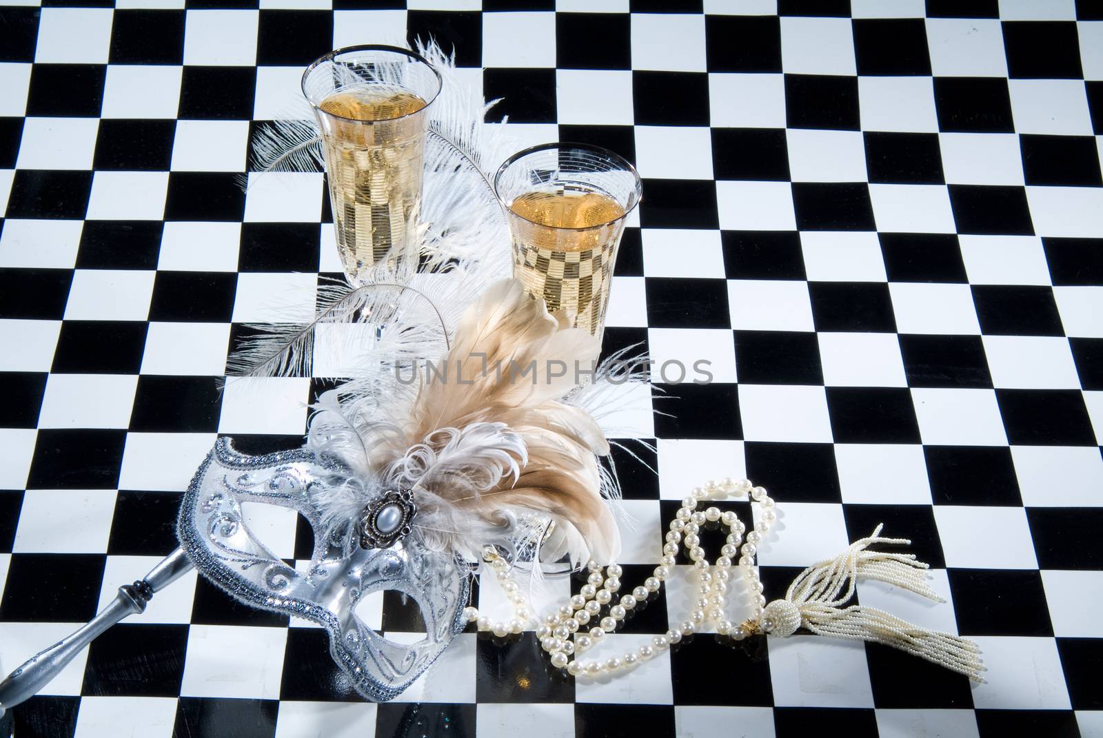 Decorative elements on a checkered studio background
