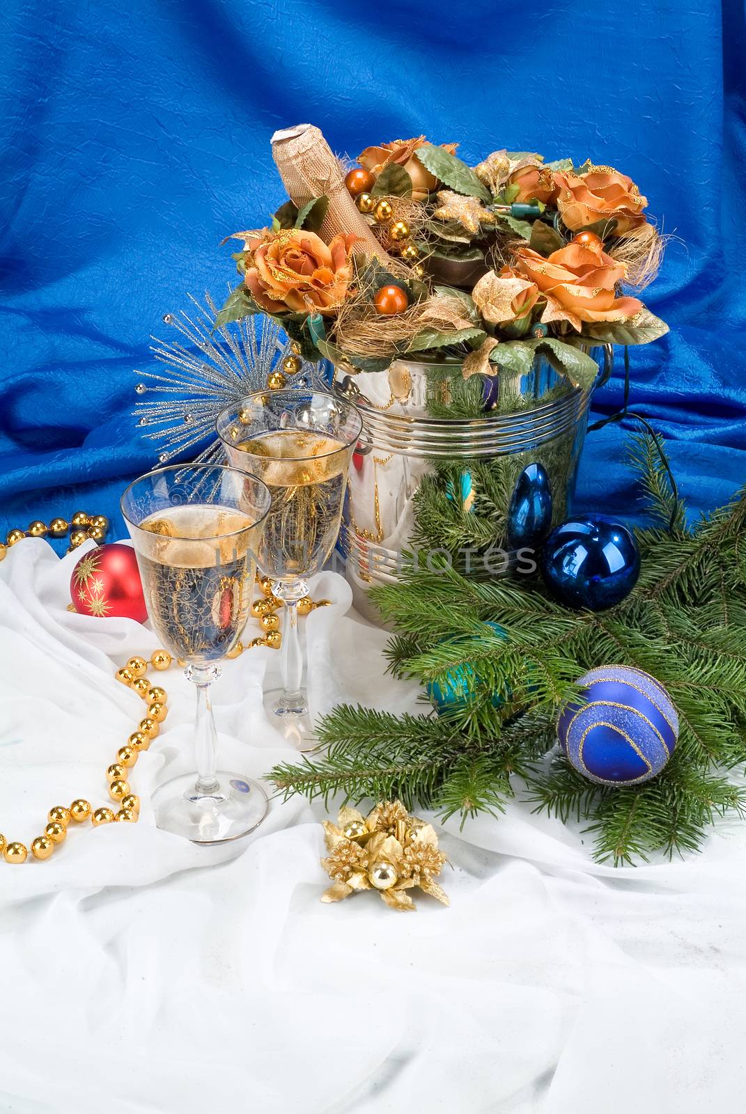 Glasses with wine on a decorative fabric background