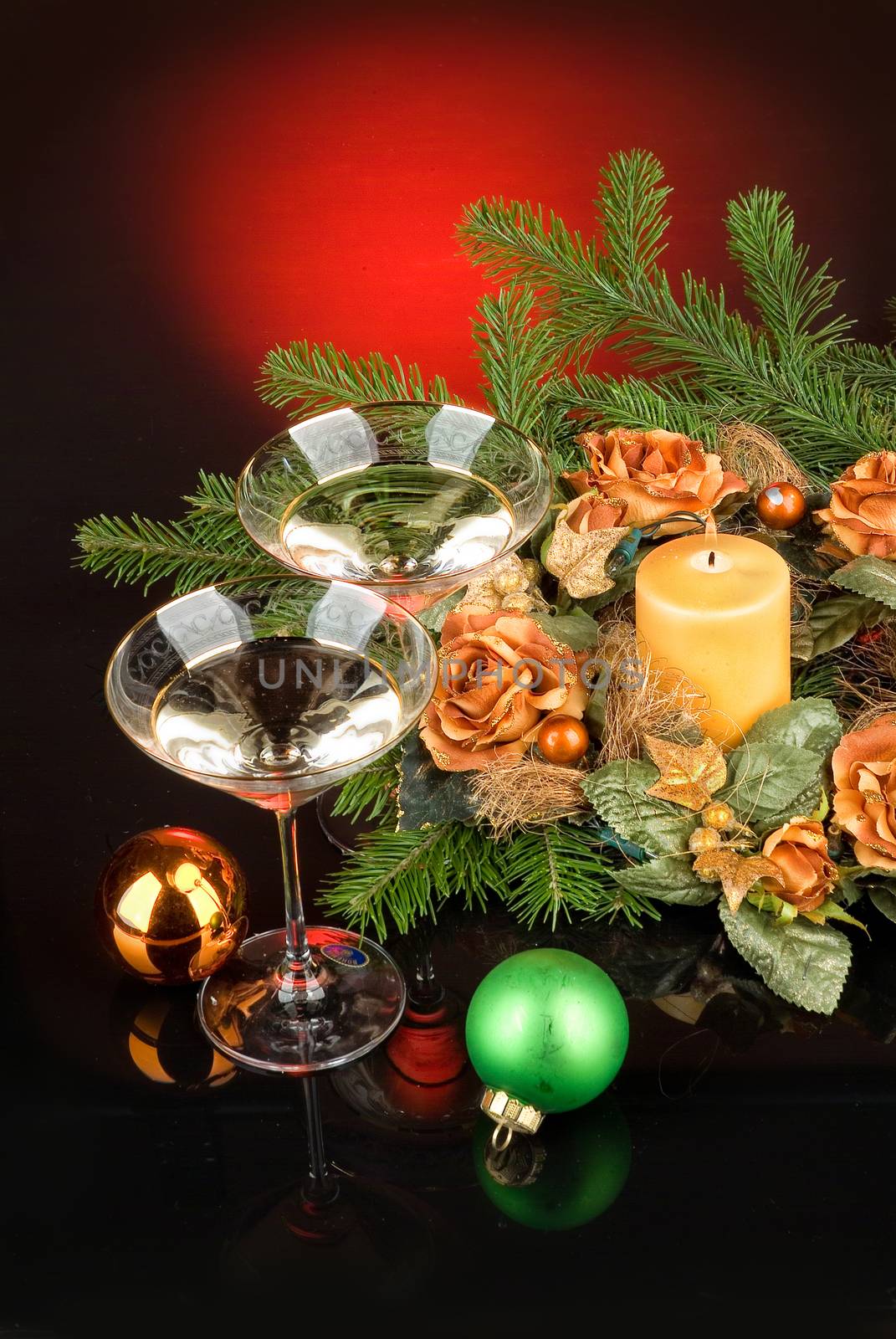 Glasses with wine on a decorative fabric background