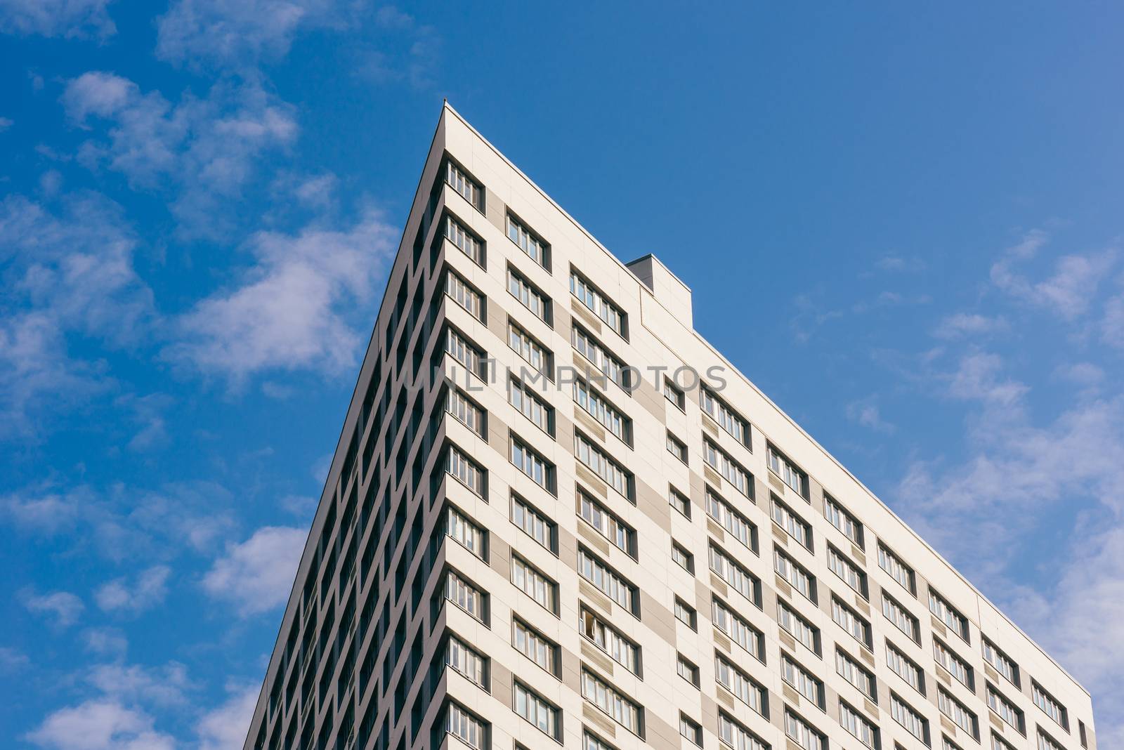 Angle of the Skyscraper on the Cloudy Sky Background.