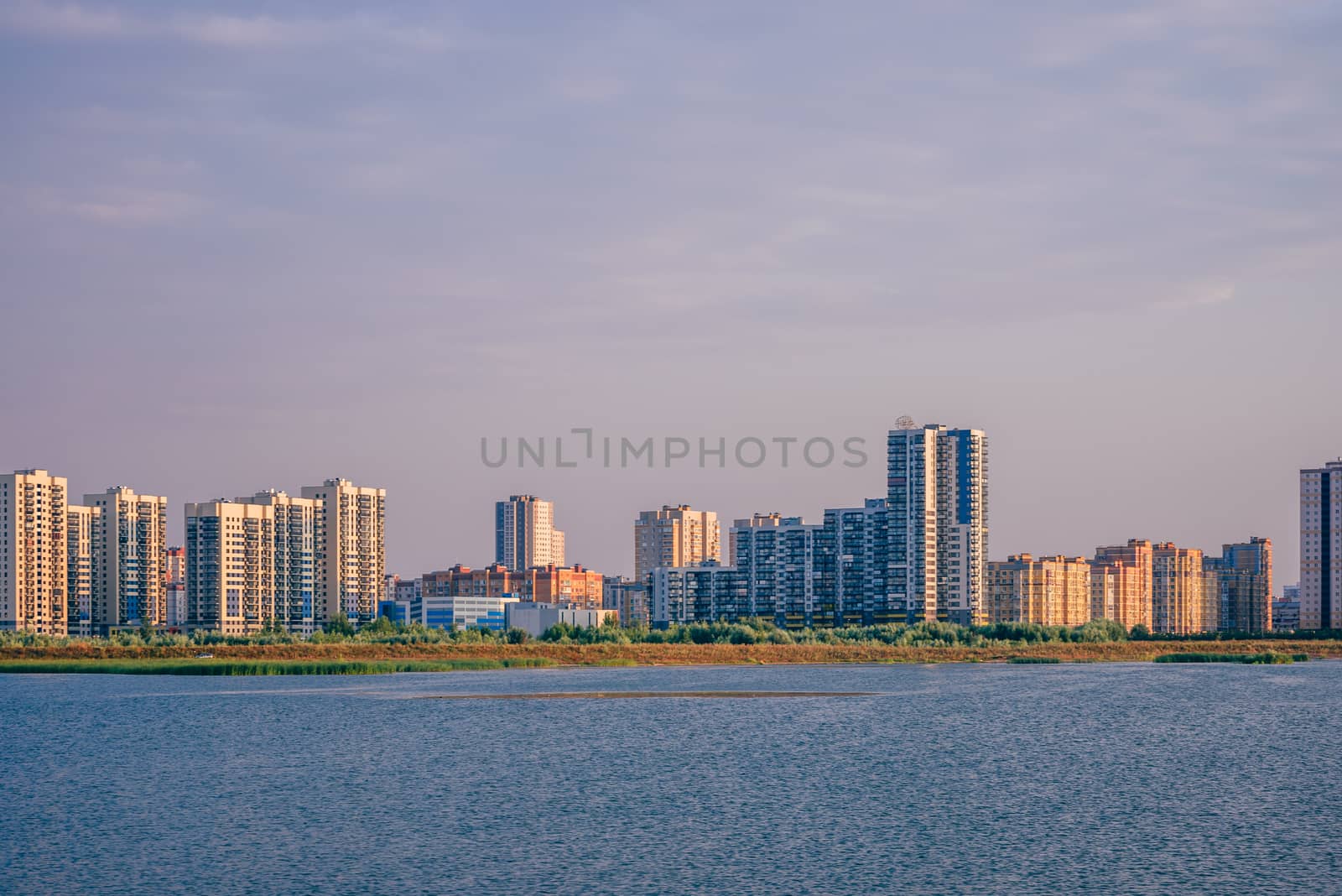 Urban landscape of commuter town on river bank in Kazan, Russia