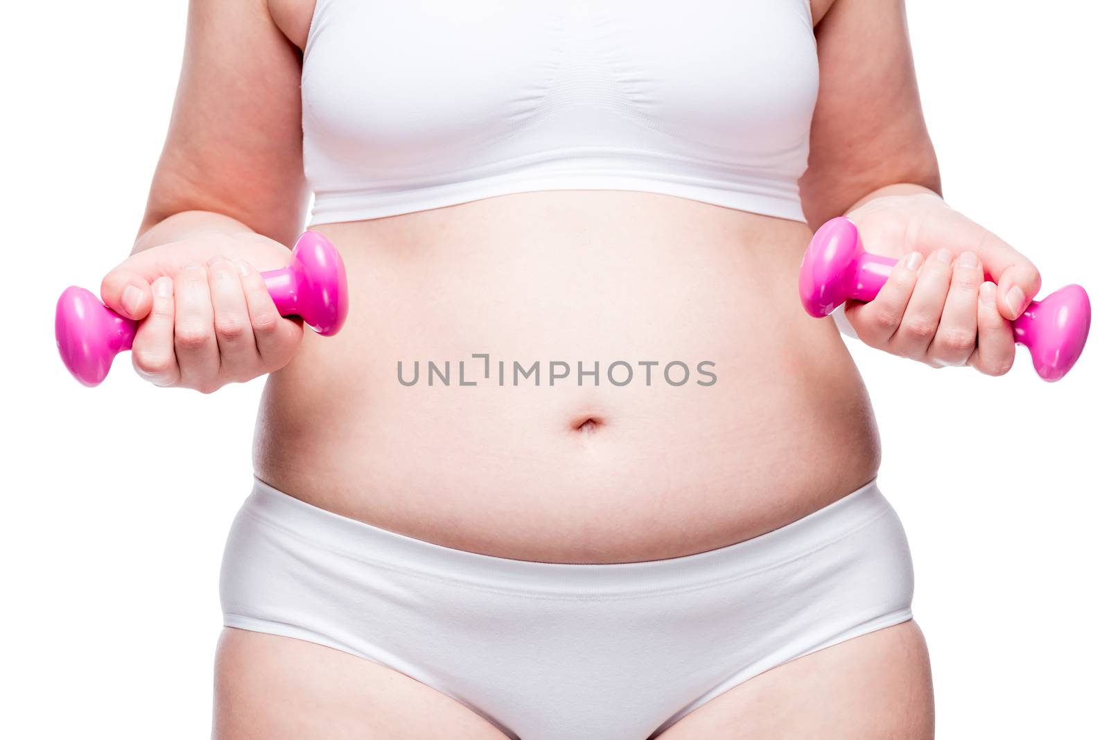 weight loss readiness. Woman with a fat belly holds dumbbells in her hands