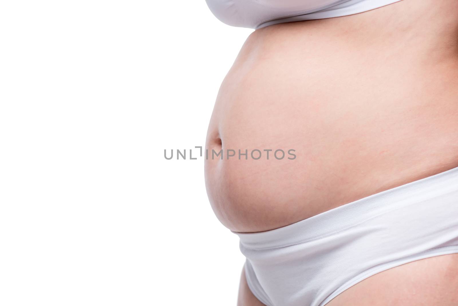 isolated fat belly of a woman in underwear on a white background