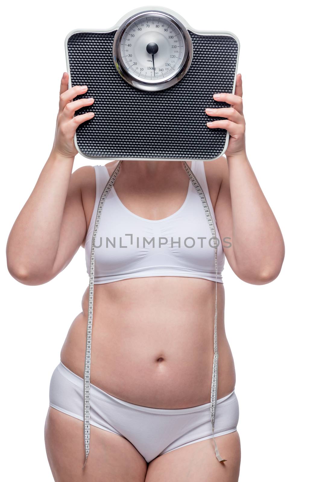 fat woman in underwear covers her face with scales, portrait is isolated