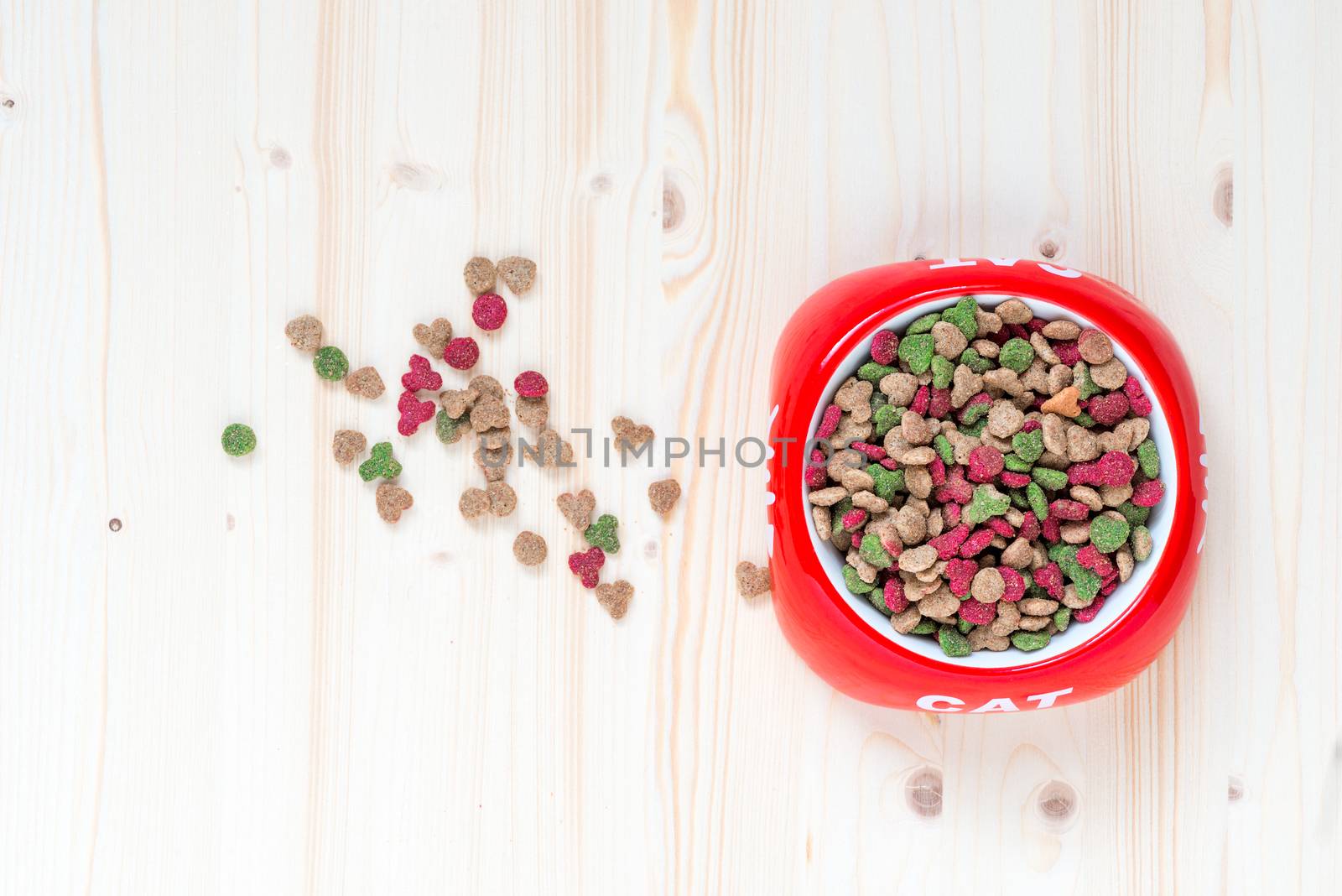 cat bowl with dry food top view close-up by kosmsos111