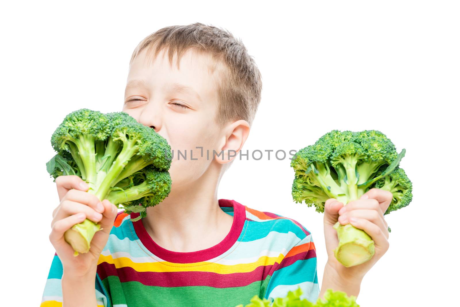 Vegetarian boy with broccoli on white background, portrait isolated
