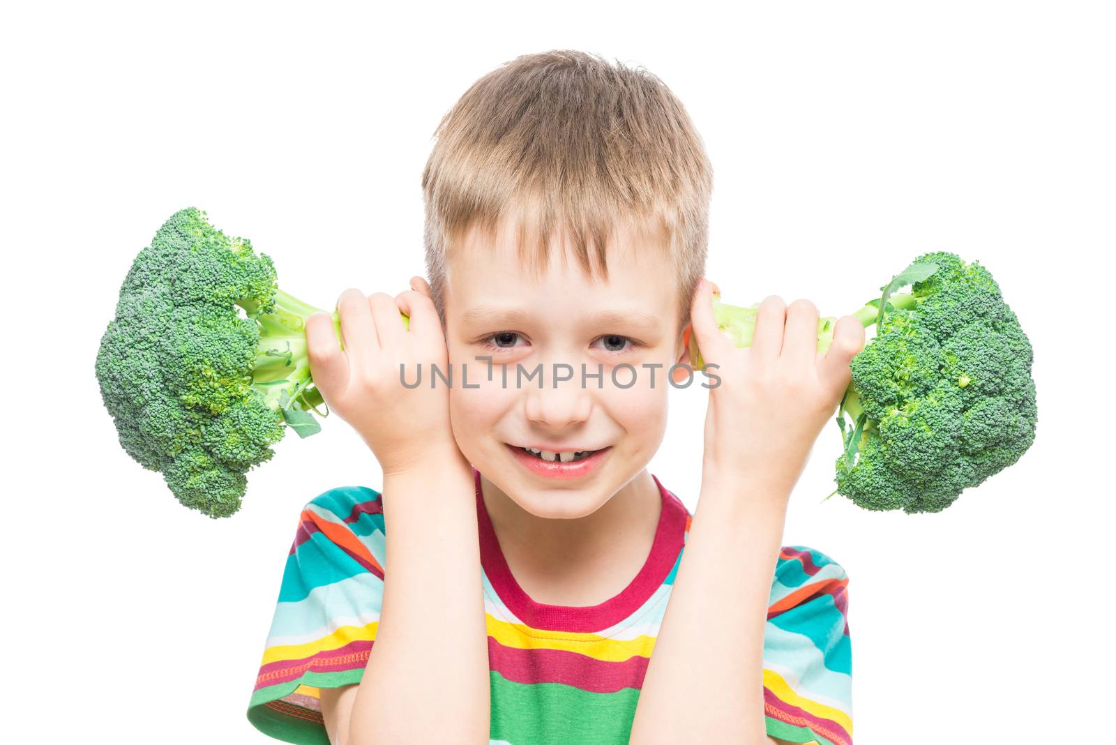 boy with broccoli, studio portrait on white background isolated