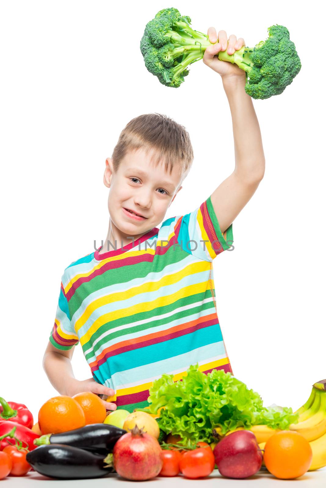 Athlete and dumbbell from broccoli, a portrait of a boy with vegetables on a white background