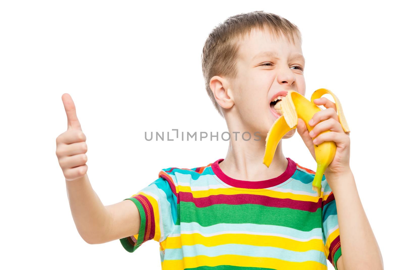 Happy boy eats tasty banana on white background, portrait is iso by kosmsos111