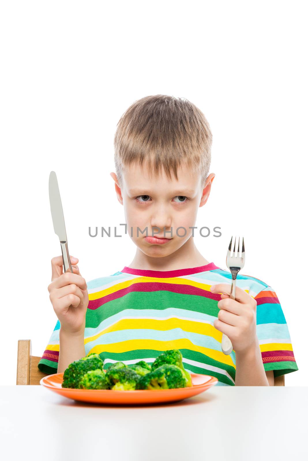 The boy with the unloved food broccoli on a white background by kosmsos111