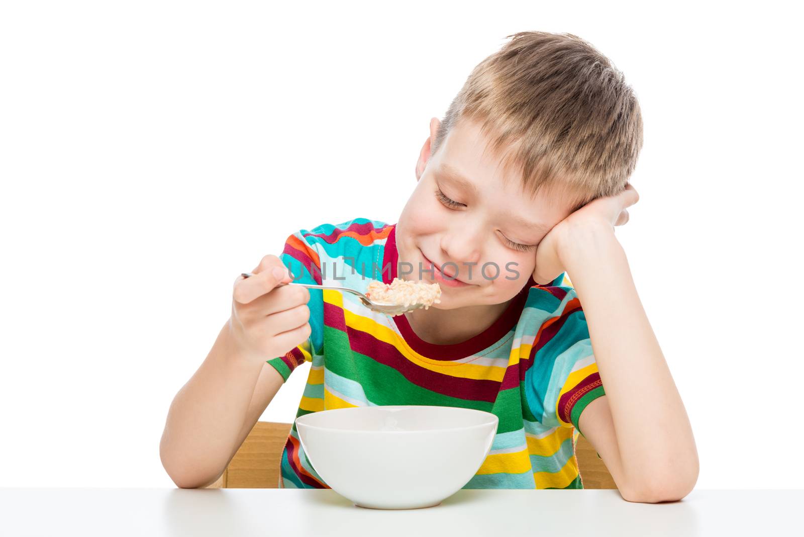 healthy food - oatmeal for breakfast, a boy with a plate on a wh by kosmsos111