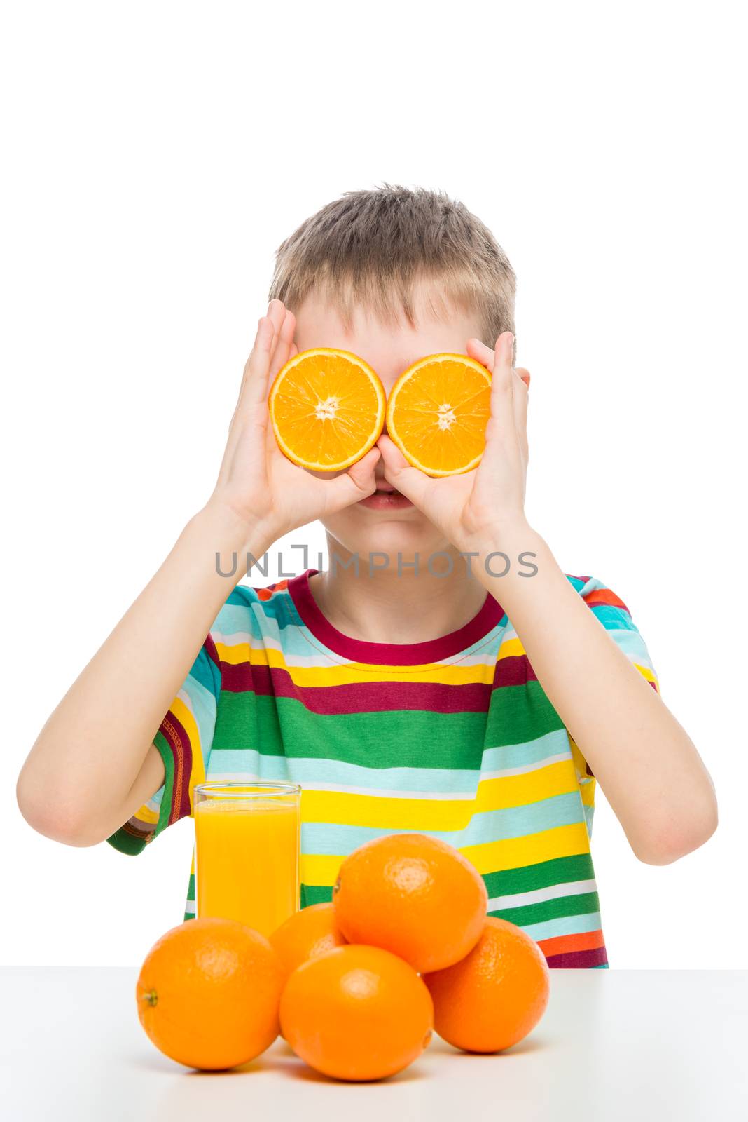 funny boy with oranges and fresh juice posing on a white background