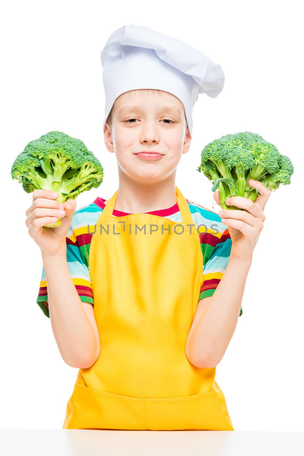 little cook in hat and apron with broccoli on white background isolated