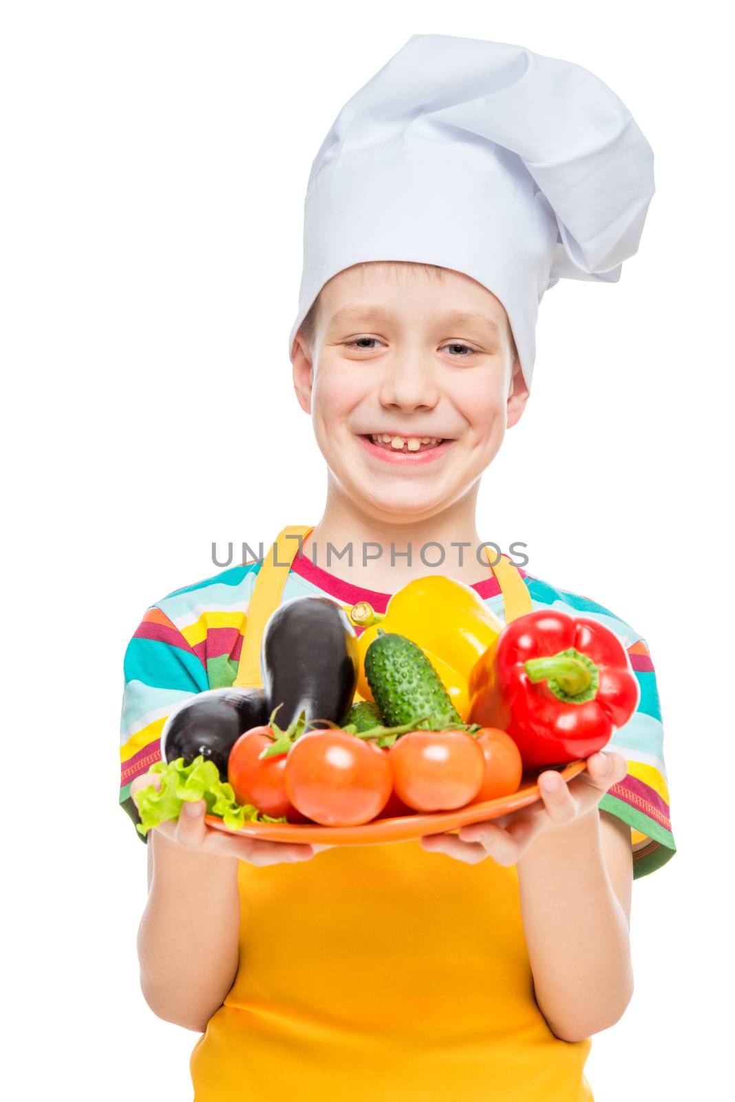 boy cook in a cap with a plate of ingredients - healthy vegetabl by kosmsos111