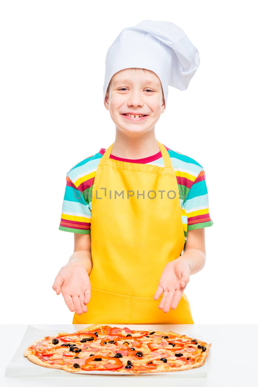 boy cook prepared pizza from natural ingredients, portrait in studio