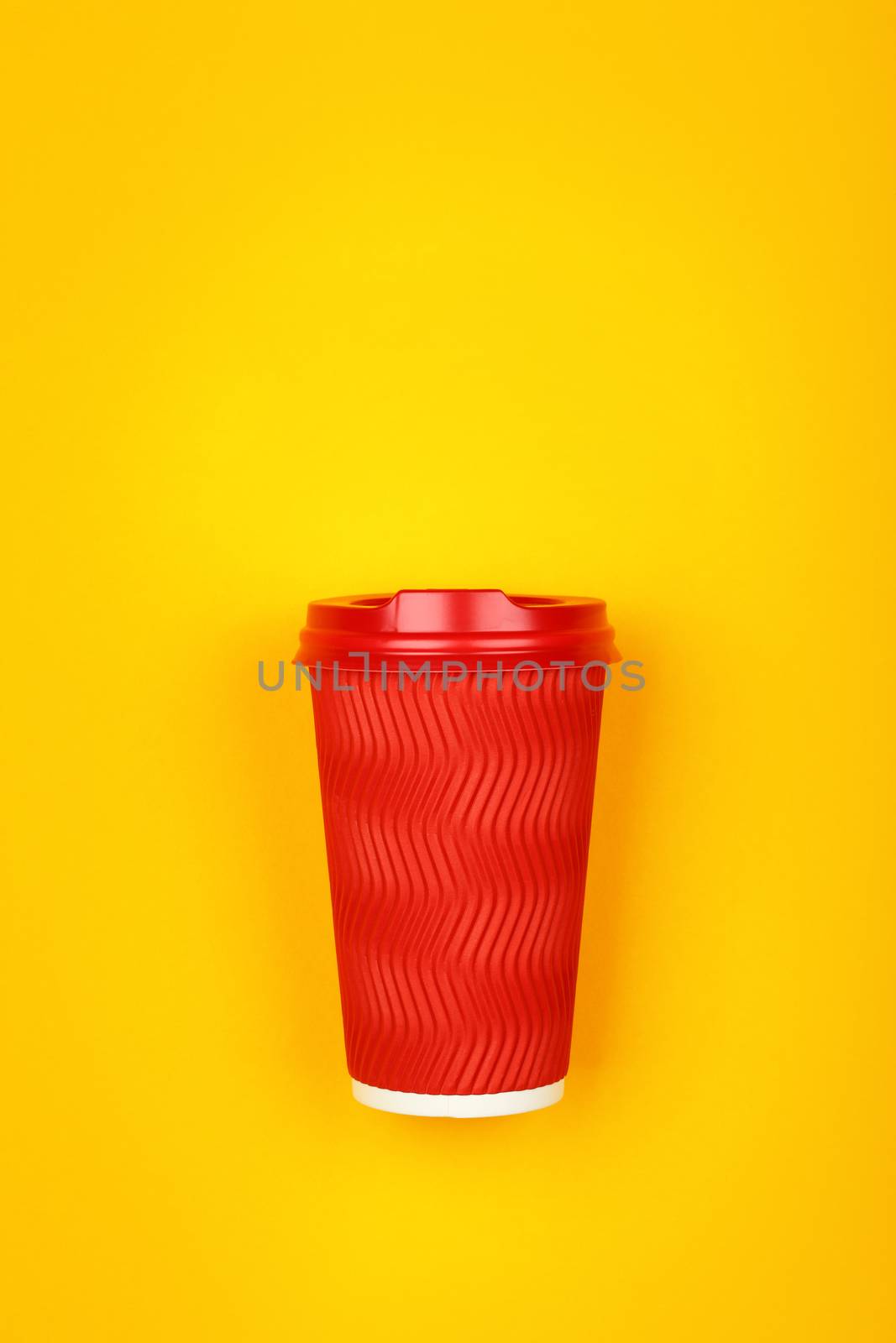 Red paper coffee cup over yellow by BreakingTheWalls