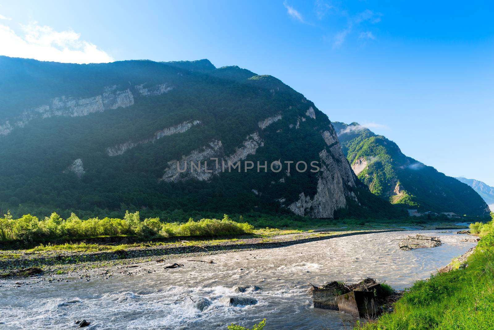 Beautiful mountain landscape. Fast mountain river in the mountai by kosmsos111