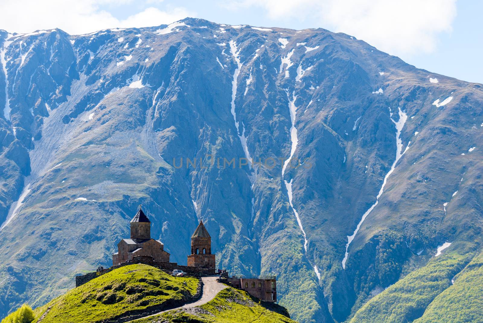 Orthodox Trinity Church in the village of Gergeti against the backdrop of the mountains, Caucasus, Georgia