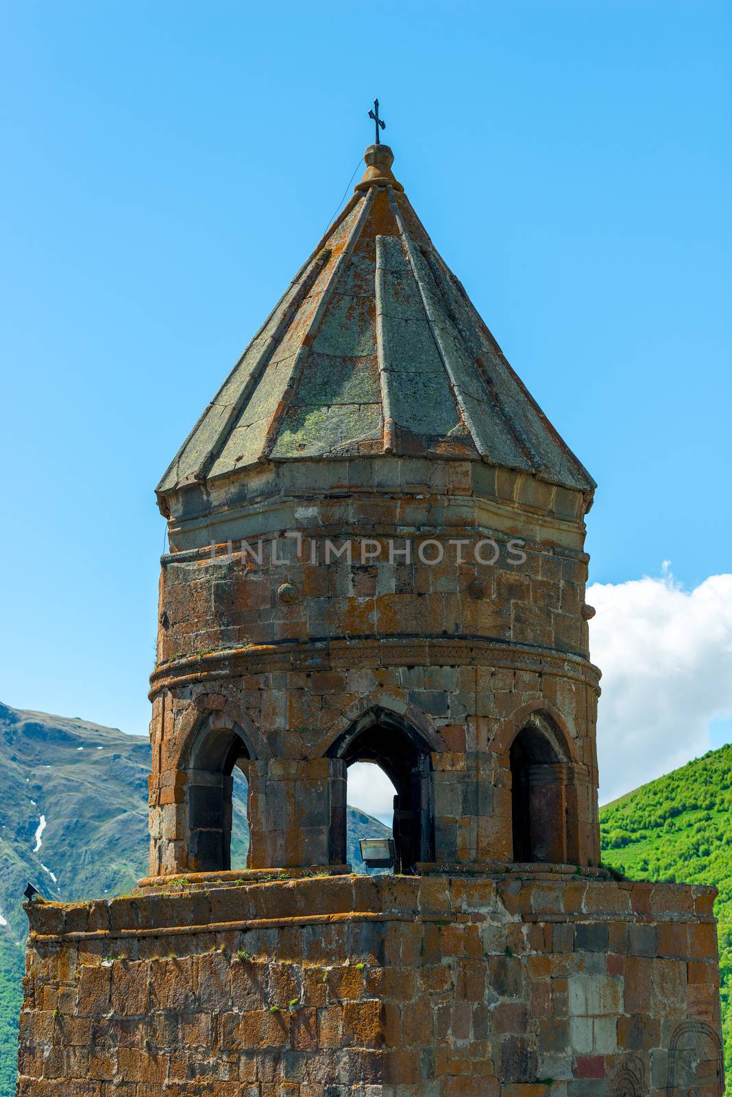 Bell tower of orthodox church in Georgia against blue sky close by kosmsos111