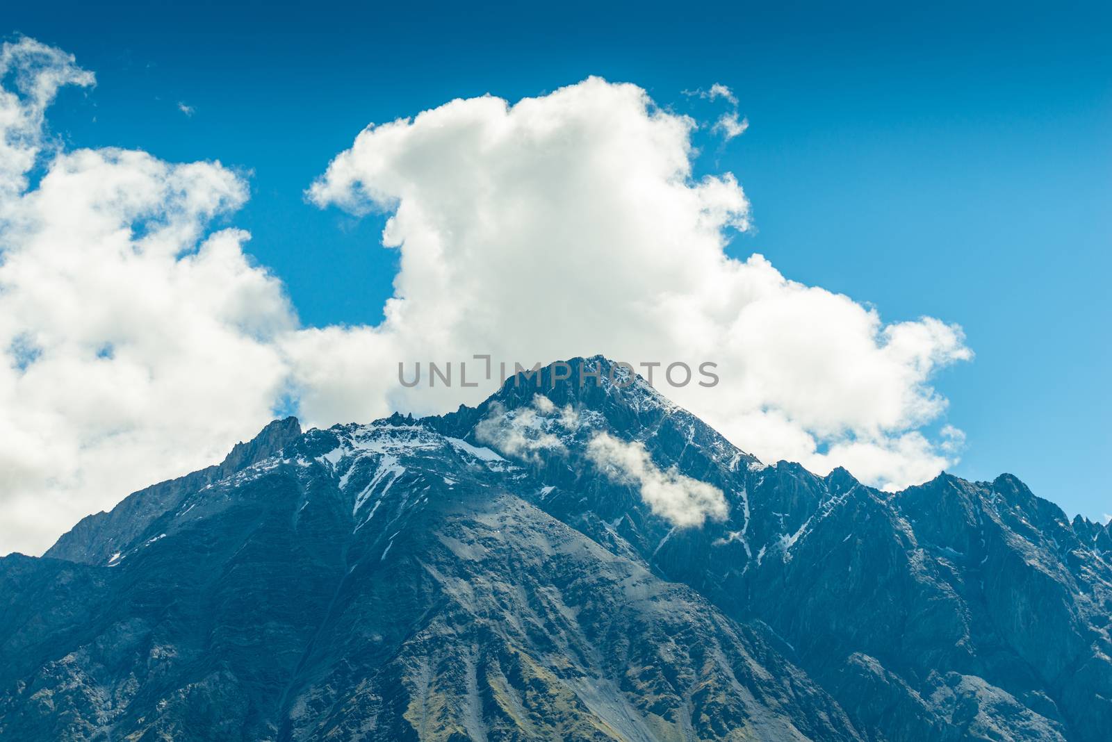 high mountain peaks and clouds, a beautiful mountain landscape o by kosmsos111