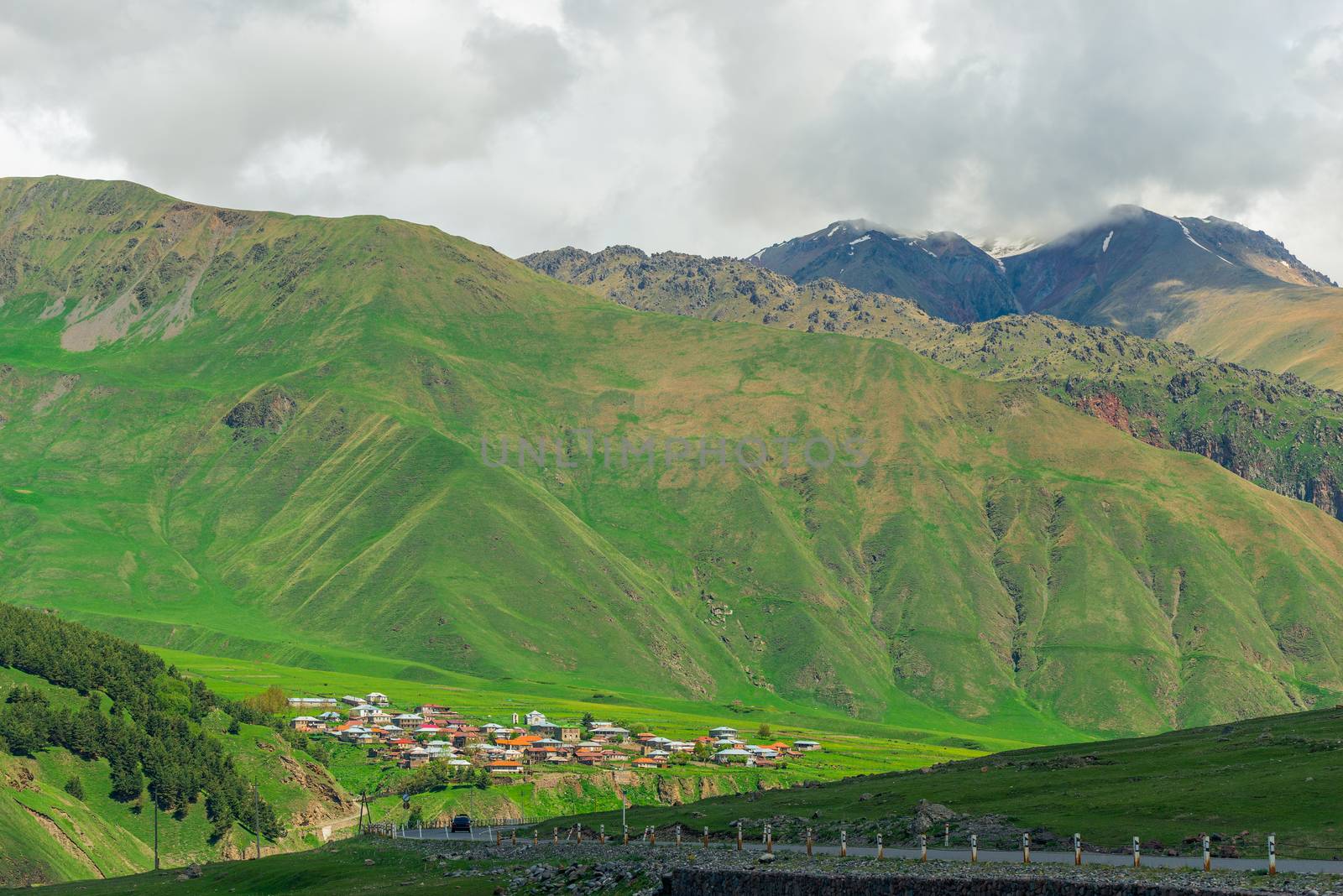 Village in Georgia on a plateau near the high mountains of the C by kosmsos111