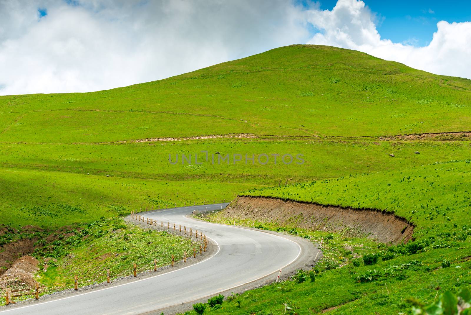 Winding automotive Georgian Military Road in a picturesque place in the Caucasus Mountains, Georgia landscape