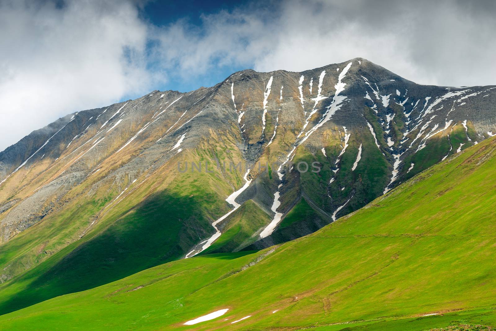Relief of the Caucasus Mountains with the remains of snow in the hollows, Caucasus Mountains in June, Georgia
