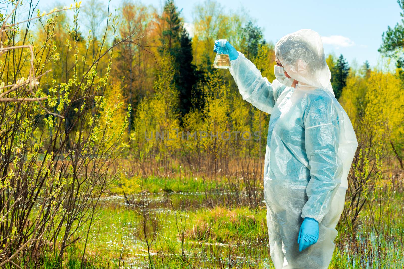 a researcher chemist-environmentalist conducts a visual inspecti by kosmsos111