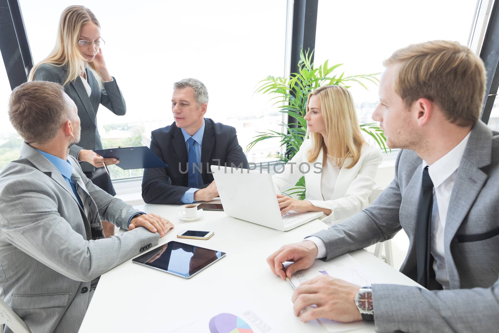 Group of Business people discussing a financial documents at meeting