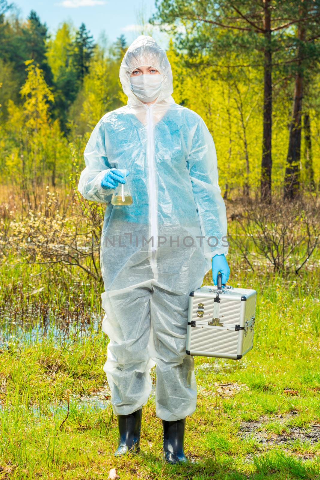 full-length portrait of an ecologist with a flask and water research tools