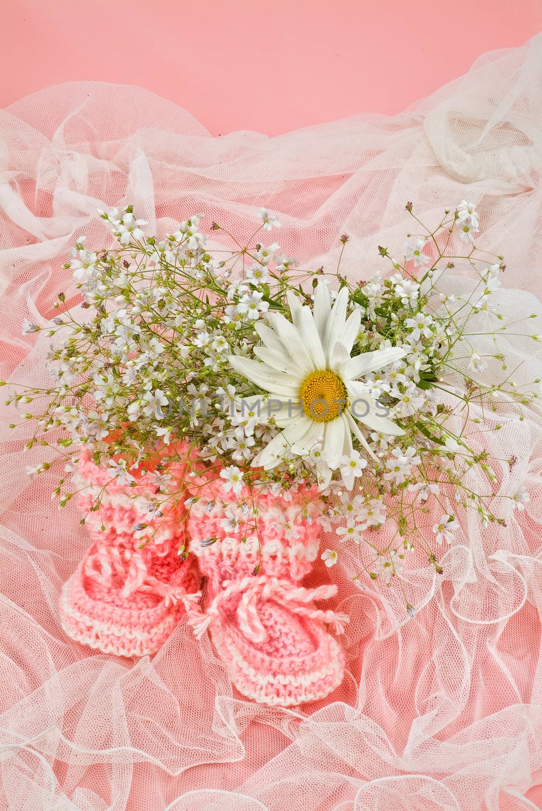 Still life with bouquet of flowers and accessories on a studio background