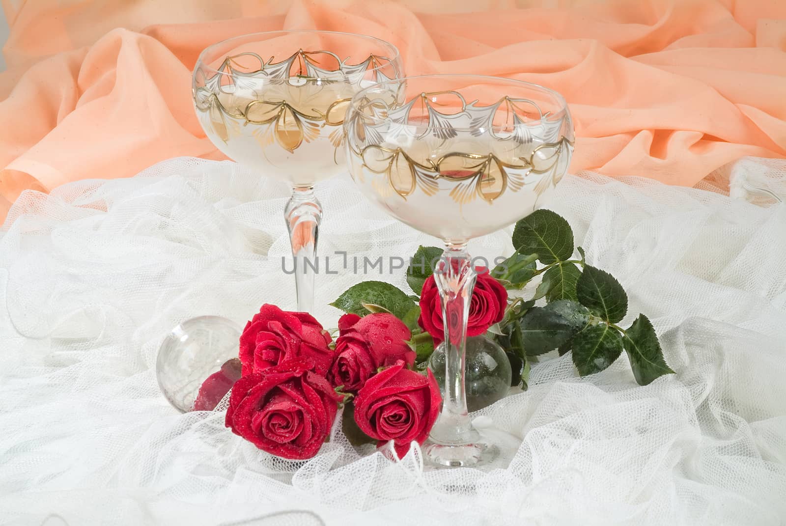 Still life with bouquet of flowers and accessories on a studio background