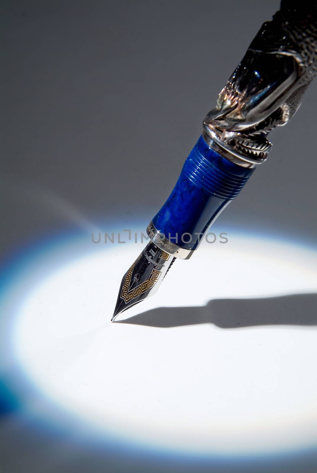 Pen and shadow on a studio background