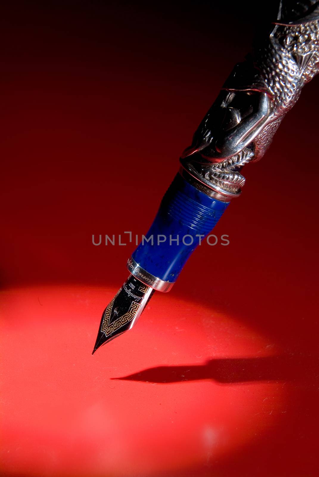 Pen and shadow on a studio background