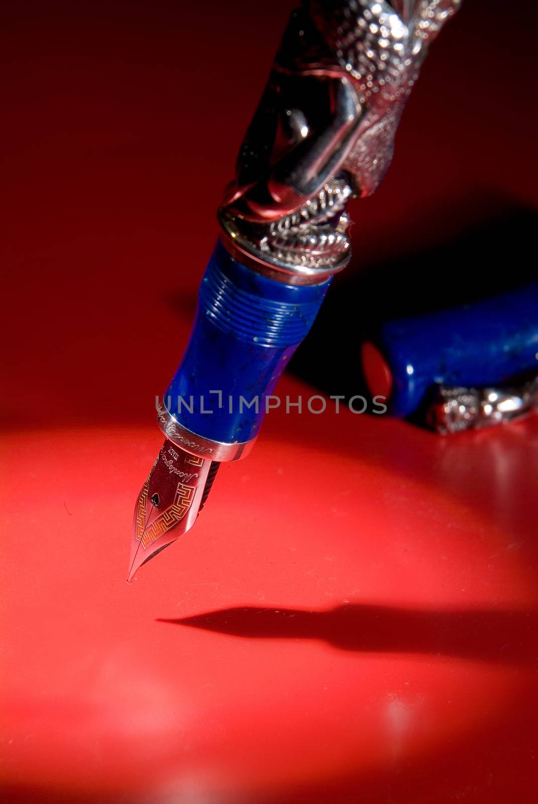 Pen and shadow on a studio background