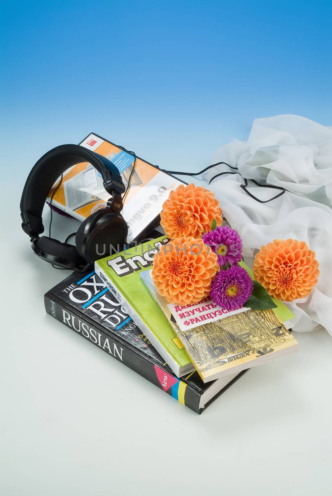 School books and accessories on a studio background